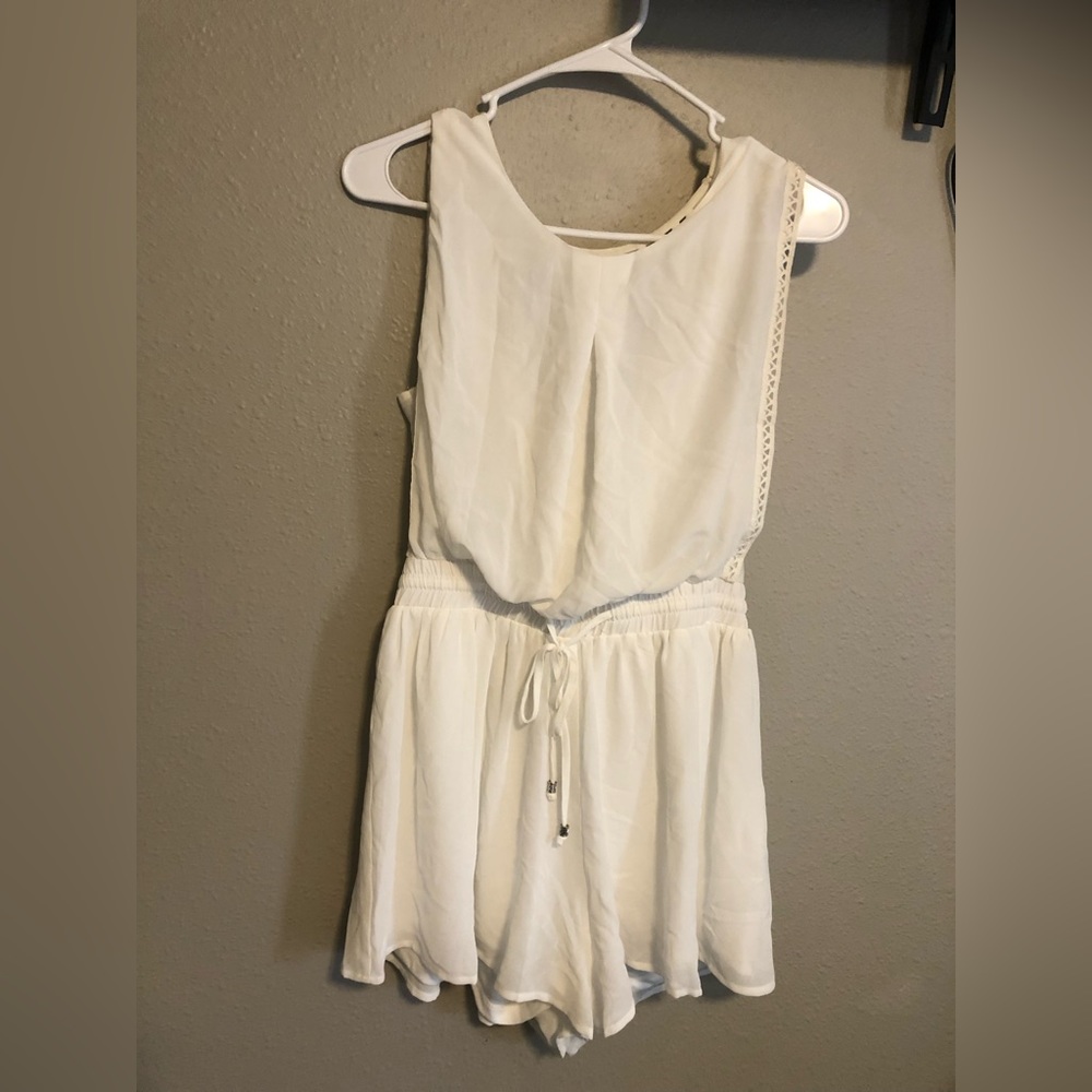 Super cute white romper. Smoke-free pet-friendly home. Worn once